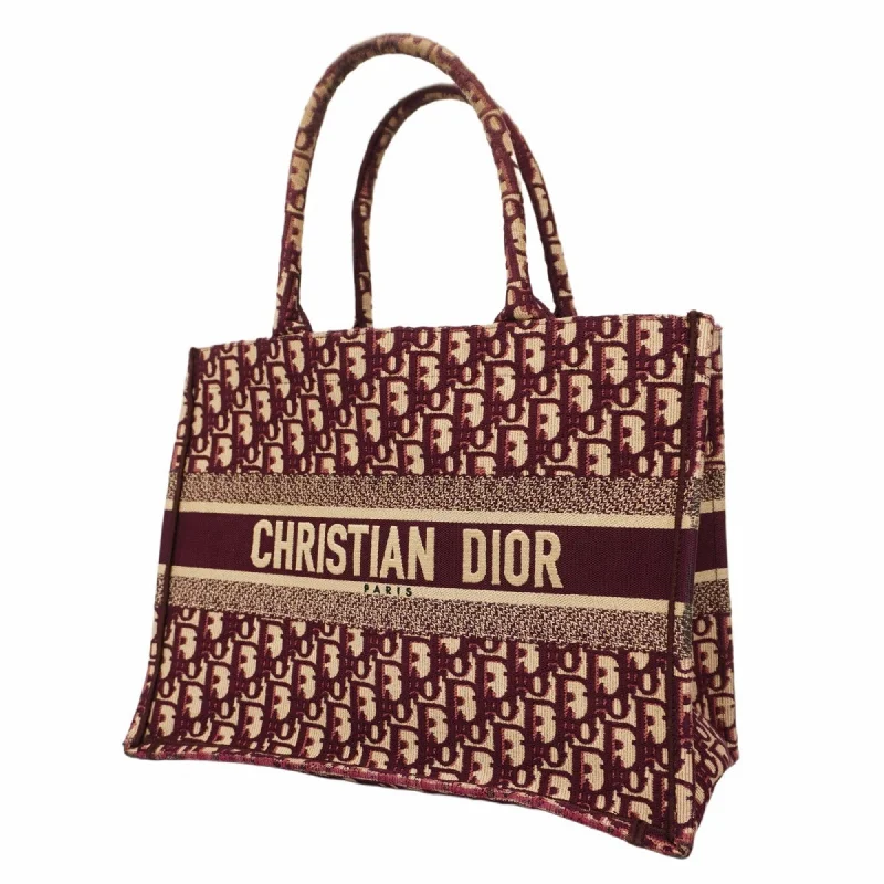 Handle bags with vibrant colors for boldness -Christian Dior  Canvas Tote Bag (Pre-Owned)