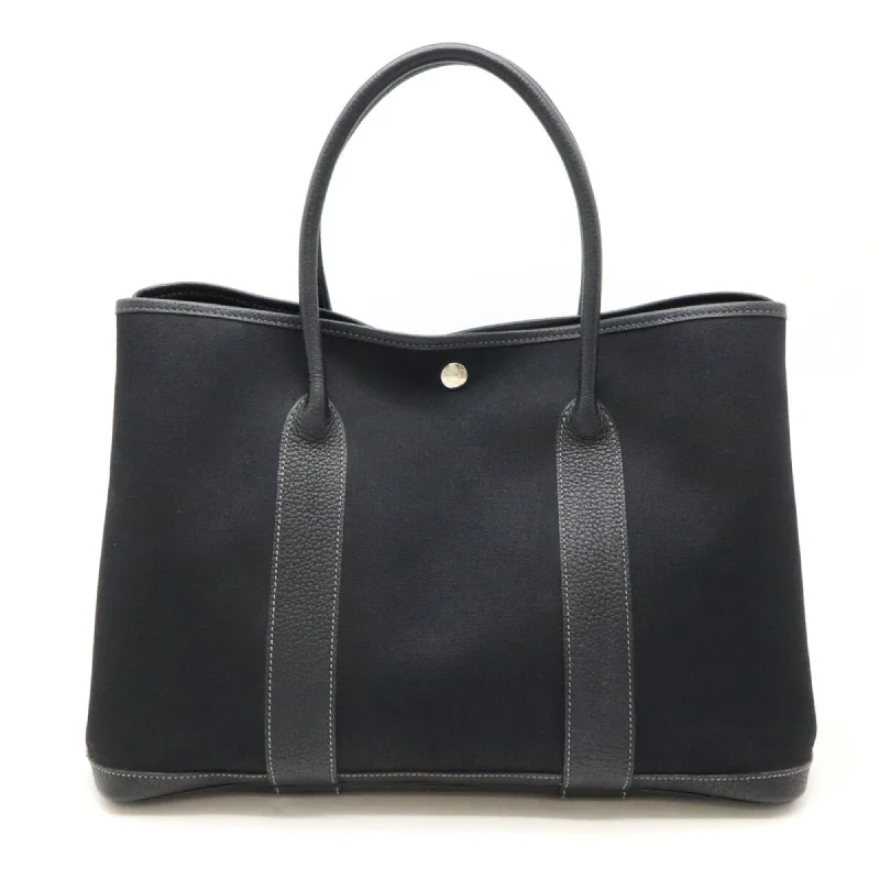 Handle bags with hidden pockets for security -Hermes  Toile Officier Handbag Tote Bag (Pre-Owned)