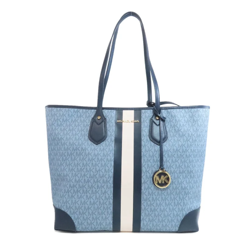 Handle bags with bright neons for visibility -Michael Kors blue Navy Pvc Tote Bag (Pre-Owned)