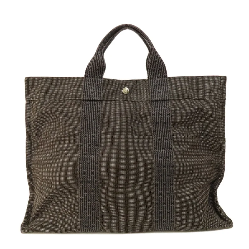 Handle bags with vintage vibes for nostalgia -Hermes Her Line  Canvas Tote Bag (Pre-Owned)