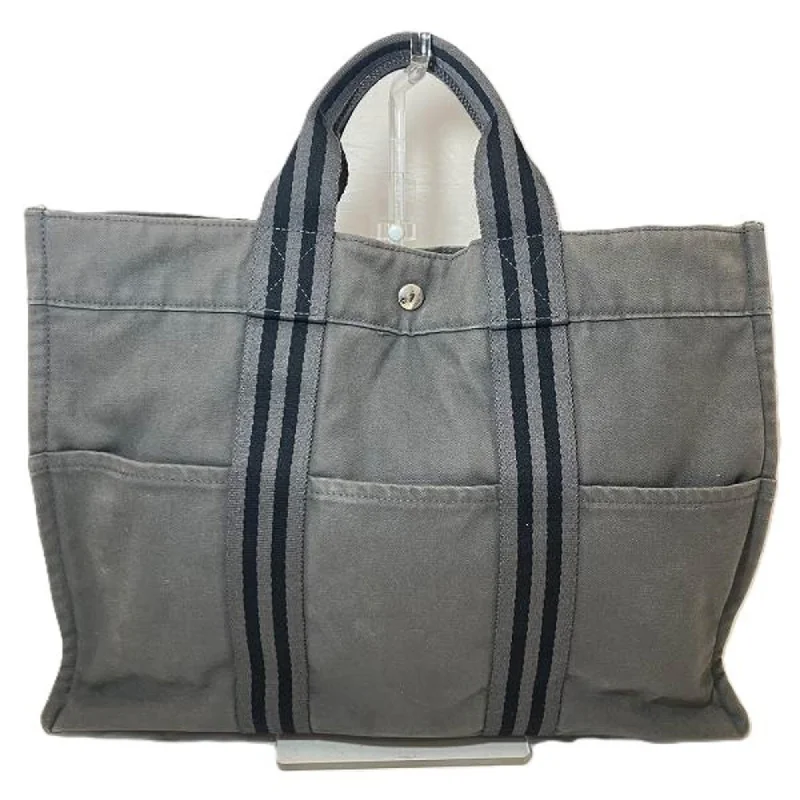 Reversible handle bags offering dual design styles -Hermes  Canvas Tote Bag (Pre-Owned)