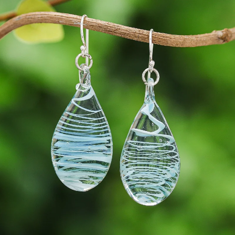 Hoop earrings with twisted leather for a chic and modern boho look-Novica Handmade Blue Ovate Leaf Handblown Glass Dangle Earrings